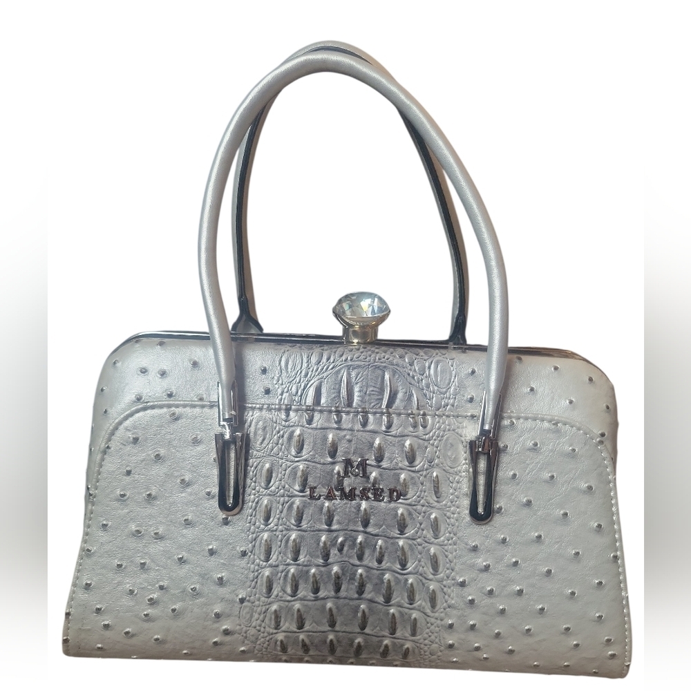 Elegant silver handbag by [M Lamsed]
